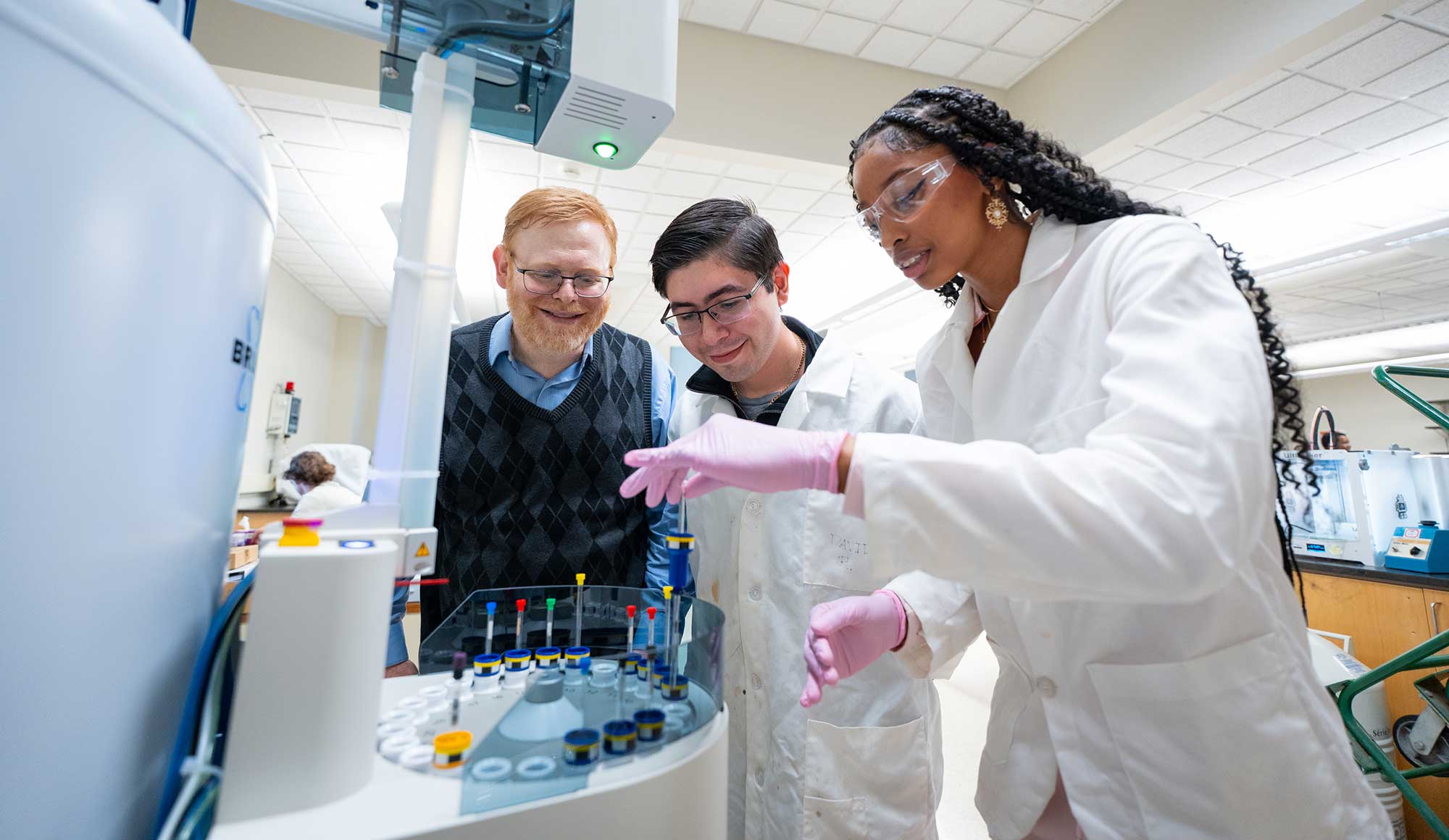 Two science, students and professor